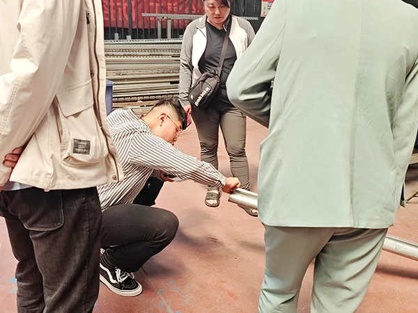 Customers are inspecting the quality of steel tubes. 
