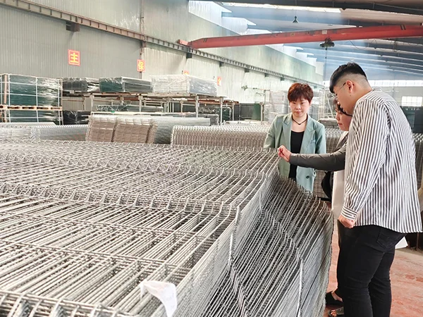 Customers are browsing our workshop and products.
