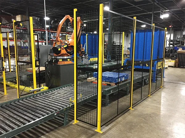 The machine guarding fences are installed surrounding the conveyor belt.