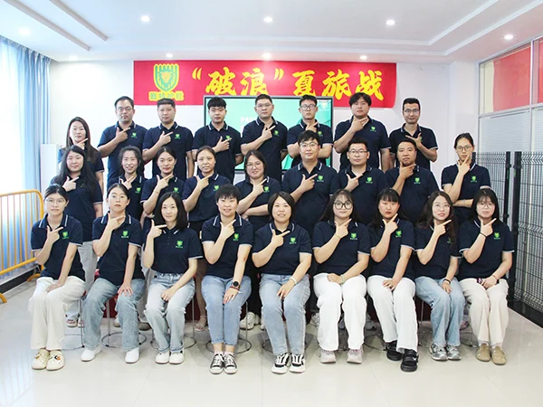 Part of the staffs taking group photos and they are smiling.