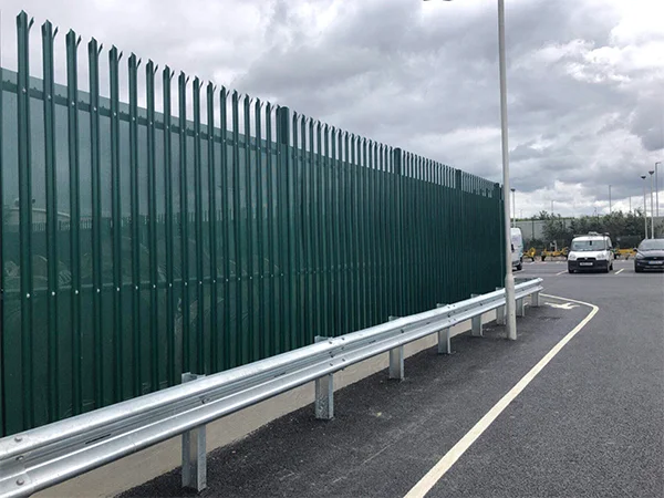 The palisade fences are installed on the road.
