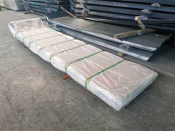 Several metal pallets of palisade fence.
