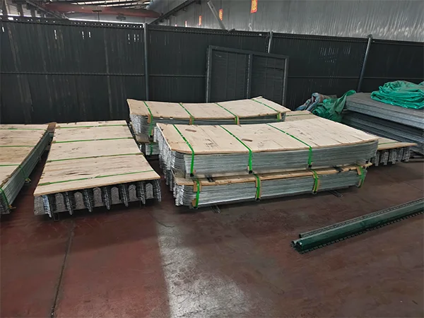 Several metal pallets of palisade fence.