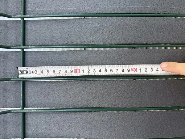 Hole size measurement 1 on a privacy fence panel.