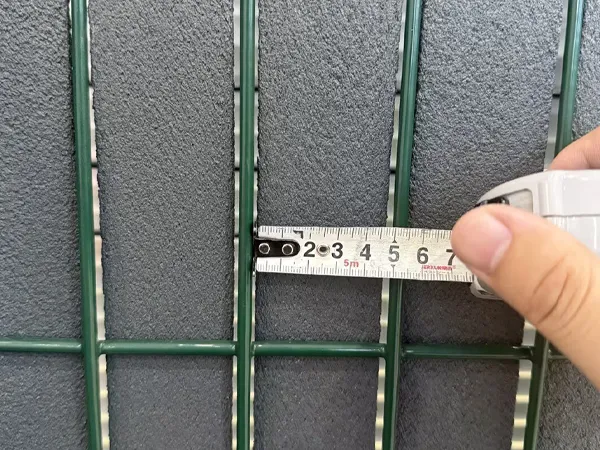 Hole size measurement 2 on a privacy fence panel.