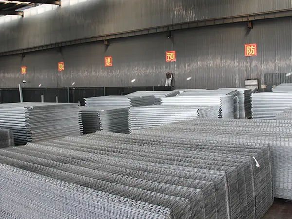 Several pieces of welded wire mesh fence in the warehouse.