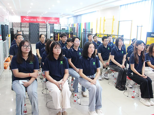 Team members are watching the broadcast of September 3rd Military Parade.