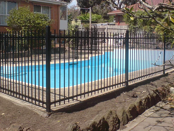 The steel tubular fences are installed surrounding the pool.