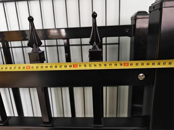 A QC worker is measuring the width of steel tubular fence.