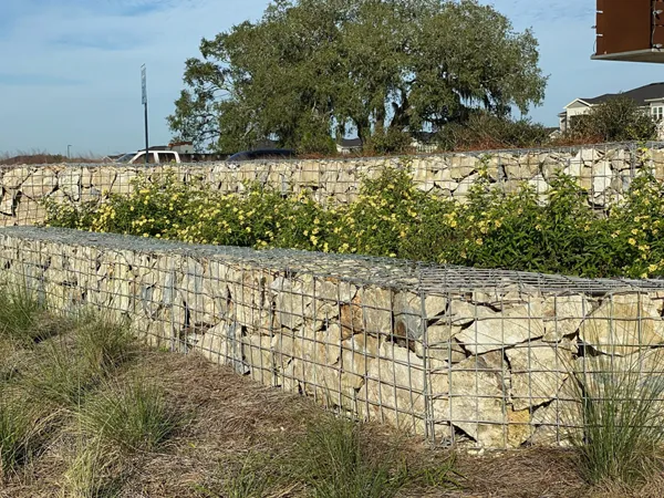 Welded Gabion retaining wall in a landscaped area.