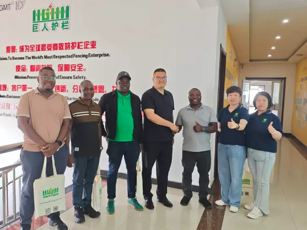 Giant Fence representatives and Zimbabwe client pose for a photo.